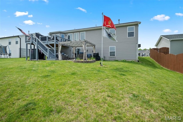 back of property featuring a pergola and a wooden deck