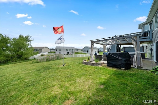 view of yard with a pergola, a patio area, and a residential view