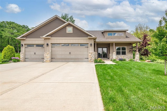 1419 Crimson King Way, Troy, IL 62294 - view of front of property with stone siding, board and batten siding, a front yard, and concrete driveway