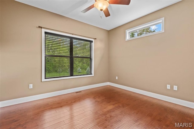 1419 Crimson King Way, Troy, IL 62294 - empty room featuring ceiling fan, baseboards, and wood finished floors