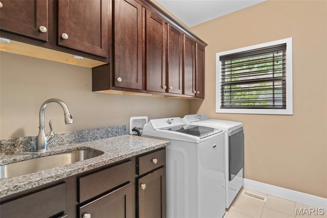1419 Crimson King Way, Troy, IL 62294 - clothes washing area featuring cabinet space, separate washer and dryer, light tile patterned floors, and baseboards