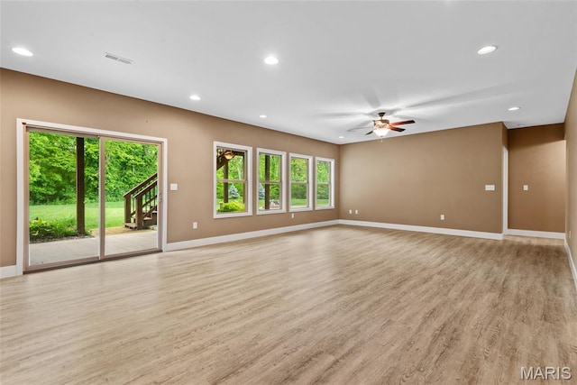 1419 Crimson King Way, Troy, IL 62294 - unfurnished living room featuring plenty of natural light, baseboards, light wood finished floors, and recessed lighting