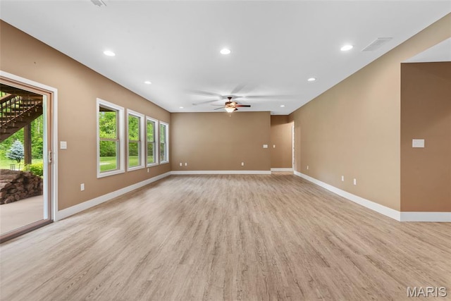 1419 Crimson King Way, Troy, IL 62294 - unfurnished living room with a ceiling fan, plenty of natural light, light wood-style floors, recessed lighting, and baseboards