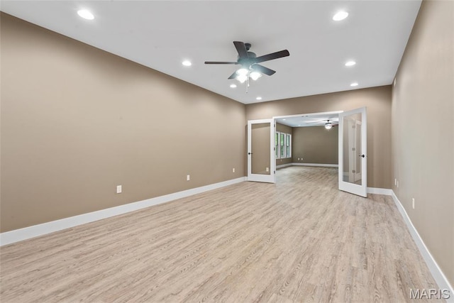 1419 Crimson King Way, Troy, IL 62294 - spare room with french doors, a ceiling fan, light wood finished floors, recessed lighting, and baseboards