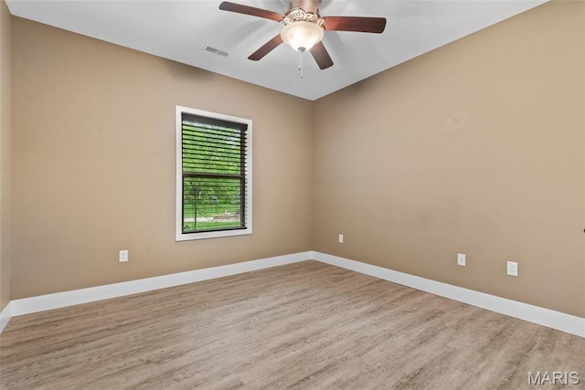 1419 Crimson King Way, Troy, IL 62294 - unfurnished room featuring wood finished floors, baseboards, and ceiling fan