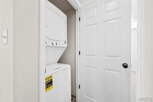 laundry room featuring stacked washing machine and dryer