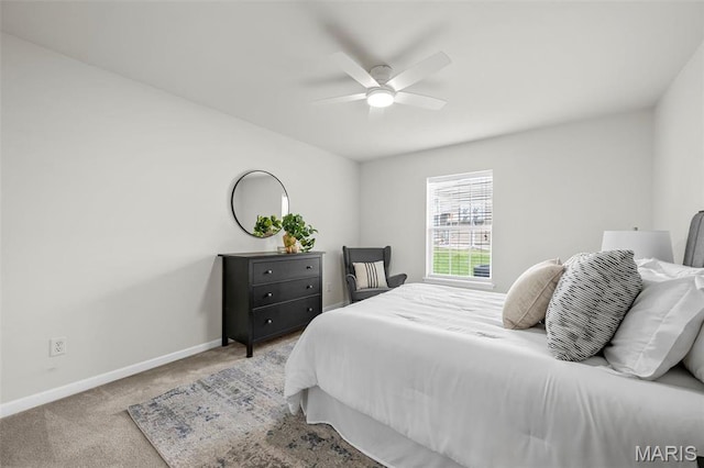 bedroom featuring baseboards, carpet flooring, and ceiling fan