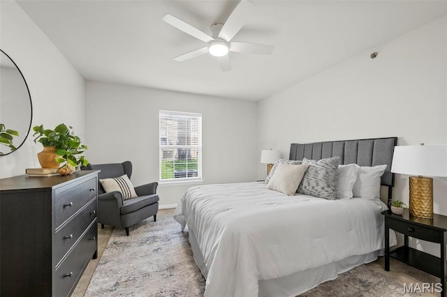 bedroom featuring a ceiling fan and baseboards