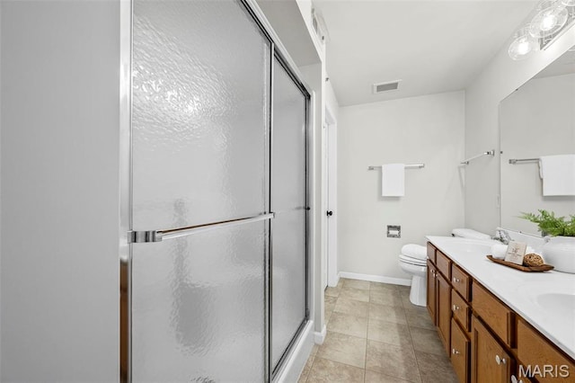 full bathroom featuring a stall shower, double vanity, baseboards, tile patterned flooring, and toilet