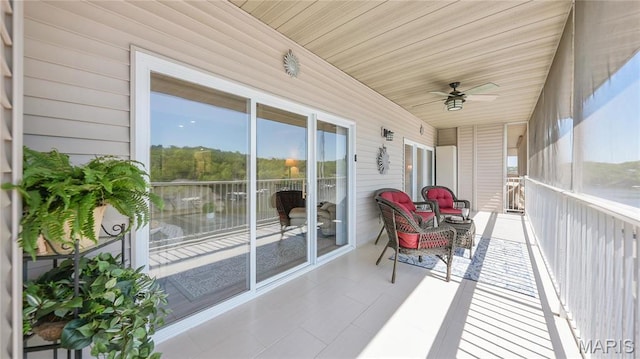 138 Oak Harbor Dr Unit 6D, Camdenton, MO 65020 - sunroom with ceiling fan and a water view
