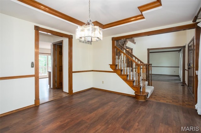 712 Carman Oaks Ct, Manchester, MO 63021 - empty room featuring a chandelier, stairway, baseboards, wood finished floors, and a raised ceiling