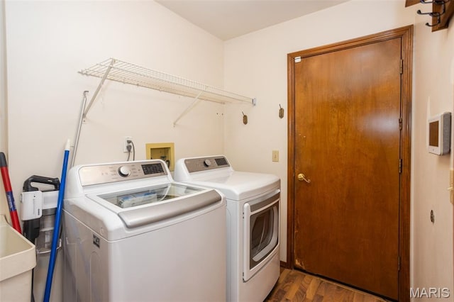 712 Carman Oaks Ct, Manchester, MO 63021 - laundry room featuring washer and dryer and wood finished floors