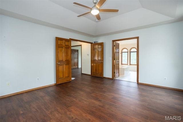 712 Carman Oaks Ct, Manchester, MO 63021 - empty room featuring ceiling fan, a raised ceiling, dark wood finished floors, and baseboards