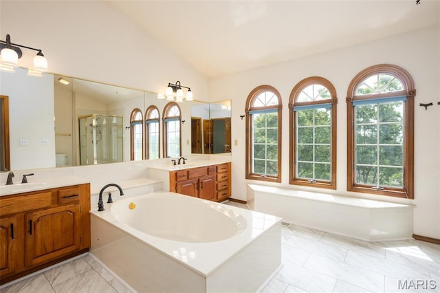 712 Carman Oaks Ct, Manchester, MO 63021 - full bath featuring a shower stall, vanity, vaulted ceiling, a bath, and marble finish floors