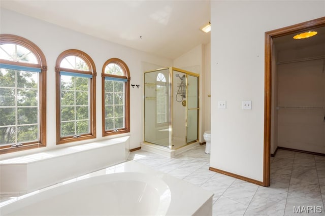 712 Carman Oaks Ct, Manchester, MO 63021 - full bathroom featuring plenty of natural light, a stall shower, marble finish floors, a garden tub, and lofted ceiling