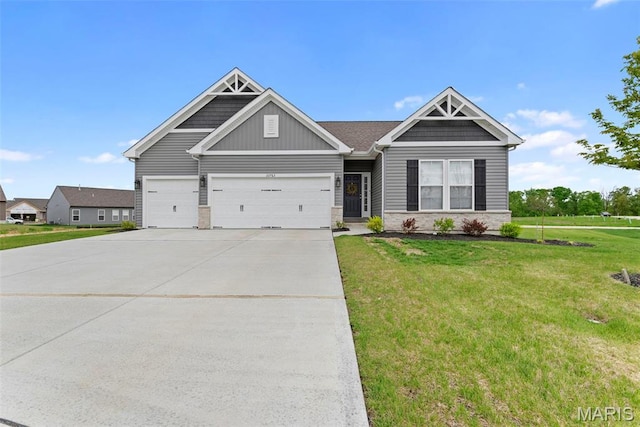 craftsman inspired home with driveway, a front yard, a garage, board and batten siding, and stone siding