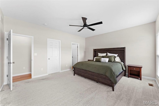 bedroom featuring carpet flooring, baseboards, and a ceiling fan