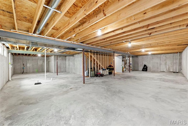 unfinished below grade area featuring stairs