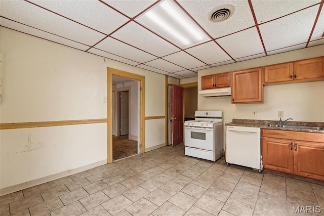 3456 Miami St, Saint Louis, MO 63118 - kitchen with white appliances, under cabinet range hood, a sink, a drop ceiling, and dark countertops
