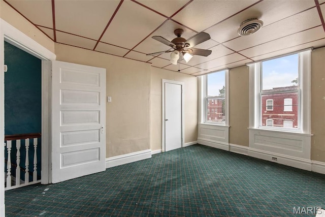 3456 Miami St, Saint Louis, MO 63118 - empty room featuring dark carpet, a ceiling fan, and baseboards