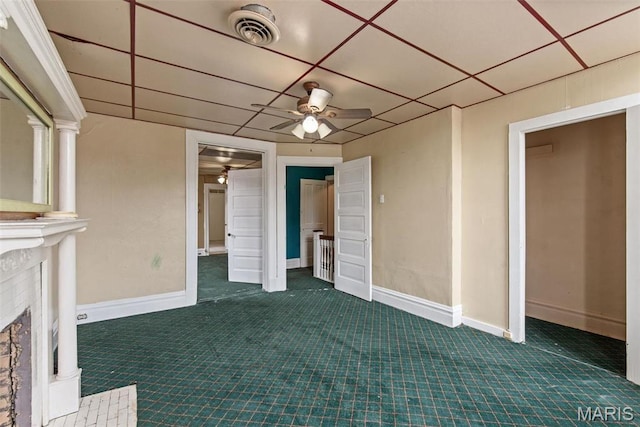 3456 Miami St, Saint Louis, MO 63118 - unfurnished bedroom featuring dark carpet, exterior fireplace, and baseboards