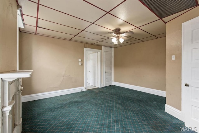 3456 Miami St, Saint Louis, MO 63118 - carpeted empty room with a ceiling fan, a drop ceiling, and baseboards