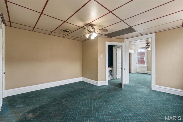 3456 Miami St, Saint Louis, MO 63118 - spare room with a ceiling fan, baseboards, and dark colored carpet