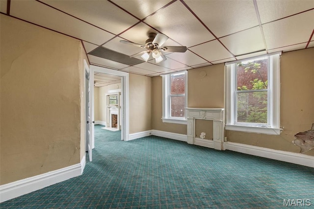 3456 Miami St, Saint Louis, MO 63118 - spare room featuring dark colored carpet, baseboards, and ceiling fan