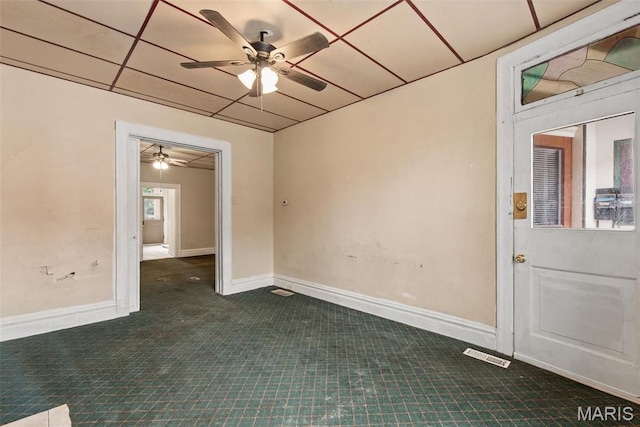 3456 Miami St, Saint Louis, MO 63118 - unfurnished room with dark colored carpet, ceiling fan, and baseboards