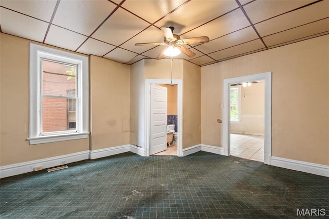 3456 Miami St, Saint Louis, MO 63118 - empty room featuring a ceiling fan, carpet floors, a paneled ceiling, and baseboards