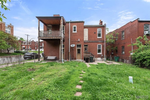 3456 Miami St, Saint Louis, MO 63118 - rear view of property featuring a balcony, brick siding, and a chimney