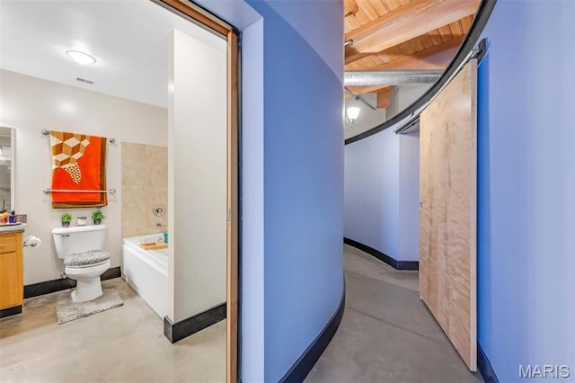 bathroom with vanity, toilet, finished concrete flooring, a tub to relax in, and beamed ceiling