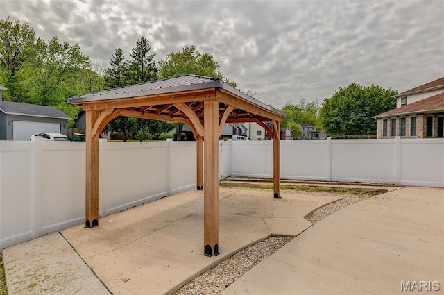 view of patio / terrace featuring a gazebo and fence