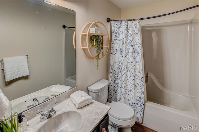 bathroom featuring shower / bath combination with curtain, toilet, and vanity
