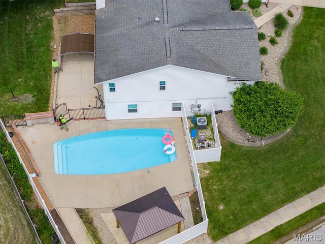 view of pool featuring fence