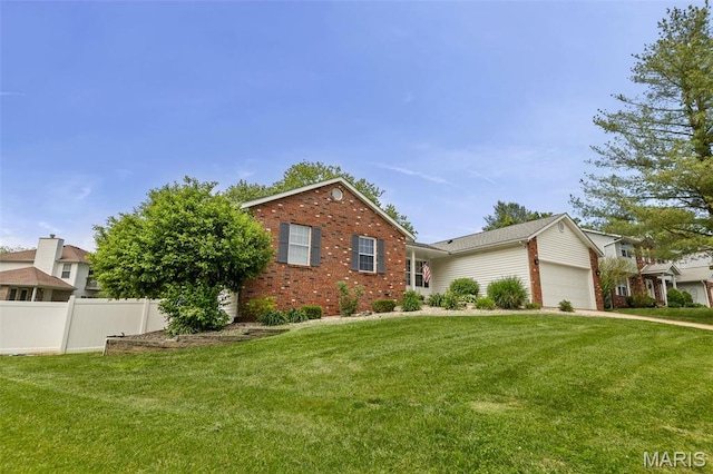 view of front of home featuring brick siding and a garage