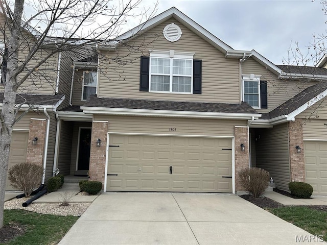 1805 Hyland Green Dr, Ofallon, MO 63366 - traditional-style house with a garage, concrete driveway, and brick siding