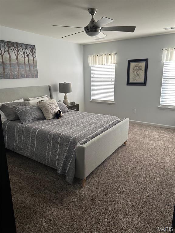 1805 Hyland Green Dr, Ofallon, MO 63366 - carpeted bedroom featuring baseboards and a ceiling fan