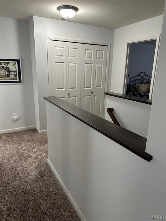 1805 Hyland Green Dr, Ofallon, MO 63366 - corridor featuring an upstairs landing, carpet flooring, and baseboards