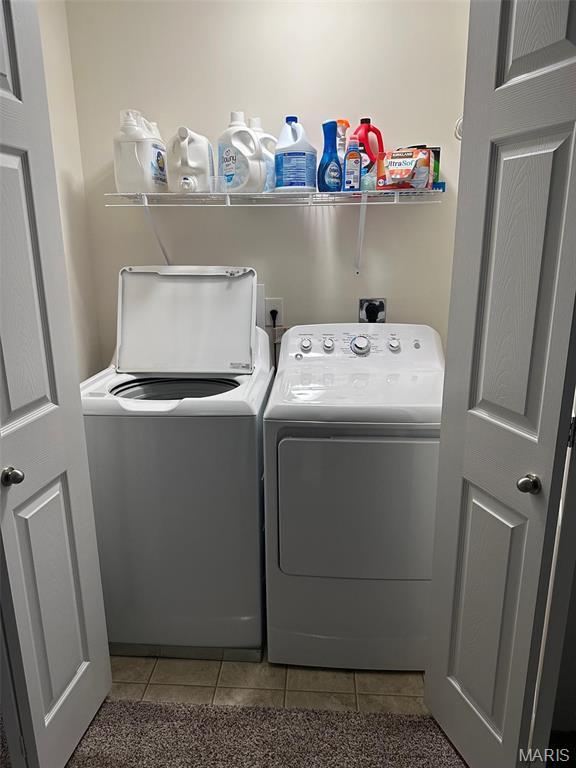 1805 Hyland Green Dr, Ofallon, MO 63366 - laundry area featuring independent washer and dryer and light tile patterned floors