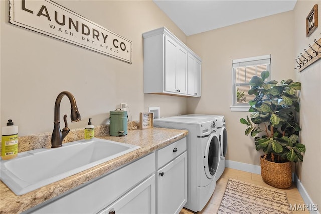 136 Oakshire Dr, Troy, IL 62294 - laundry room with washer and clothes dryer, cabinet space, baseboards, and light tile patterned flooring