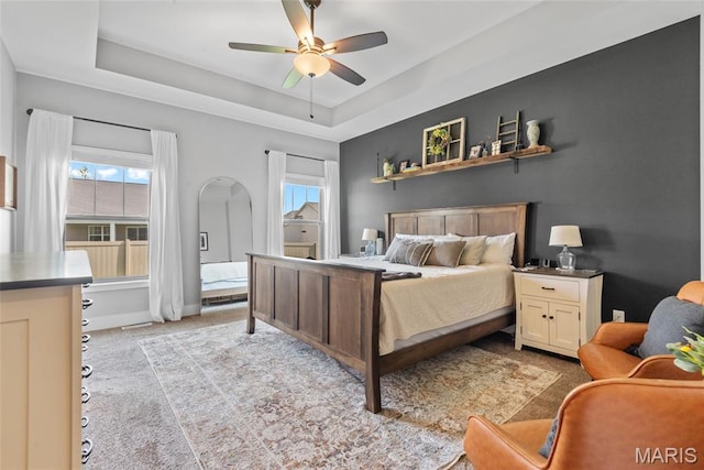 136 Oakshire Dr, Troy, IL 62294 - bedroom featuring light colored carpet, a tray ceiling, a ceiling fan, and baseboards