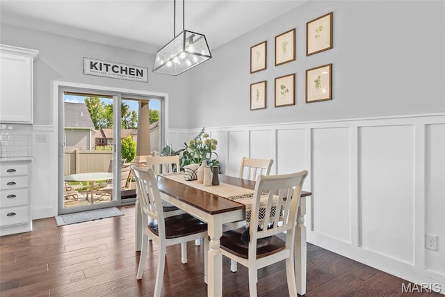 136 Oakshire Dr, Troy, IL 62294 - dining space with a decorative wall, a wainscoted wall, dark wood finished floors, and a chandelier