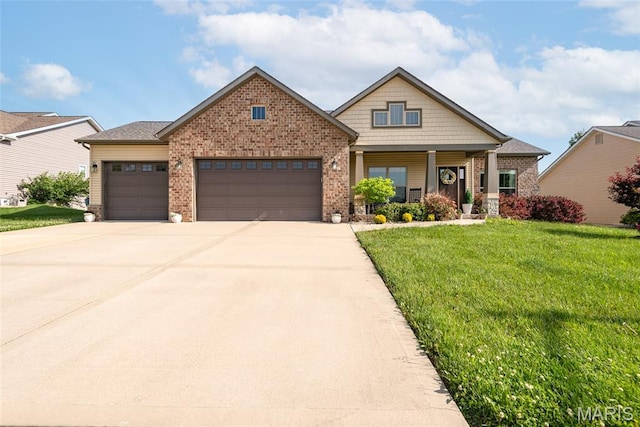 136 Oakshire Dr, Troy, IL 62294 - view of front of home featuring brick siding, a garage, a front lawn, and concrete driveway