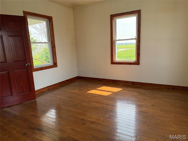 29595 State Highway 3, La Plata, MO 63549 - unfurnished room with wood-type flooring and baseboards
