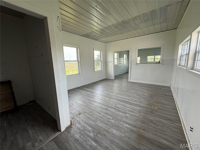 29595 State Highway 3, La Plata, MO 63549 - empty room featuring dark wood finished floors and baseboards