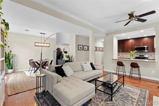 4260 Lindell Blvd Unit B, Saint Louis, MO 63108 - living room with wood finished floors, crown molding, baseboards, a ceiling fan, and recessed lighting