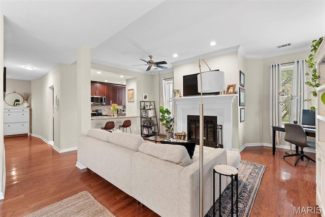 4260 Lindell Blvd Unit B, Saint Louis, MO 63108 - living room with baseboards, wood finished floors, a glass covered fireplace, ceiling fan, and recessed lighting