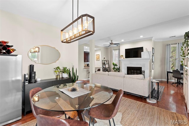 4260 Lindell Blvd Unit B, Saint Louis, MO 63108 - dining area featuring wood finished floors, recessed lighting, a ceiling fan, a glass covered fireplace, and baseboards
