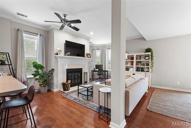 4260 Lindell Blvd Unit B, Saint Louis, MO 63108 - living area featuring a fireplace with flush hearth, healthy amount of natural light, crown molding, ceiling fan, and wood finished floors